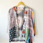 patchwork cardigan on hanger, designer viscose fabrics, hand pieced, front view